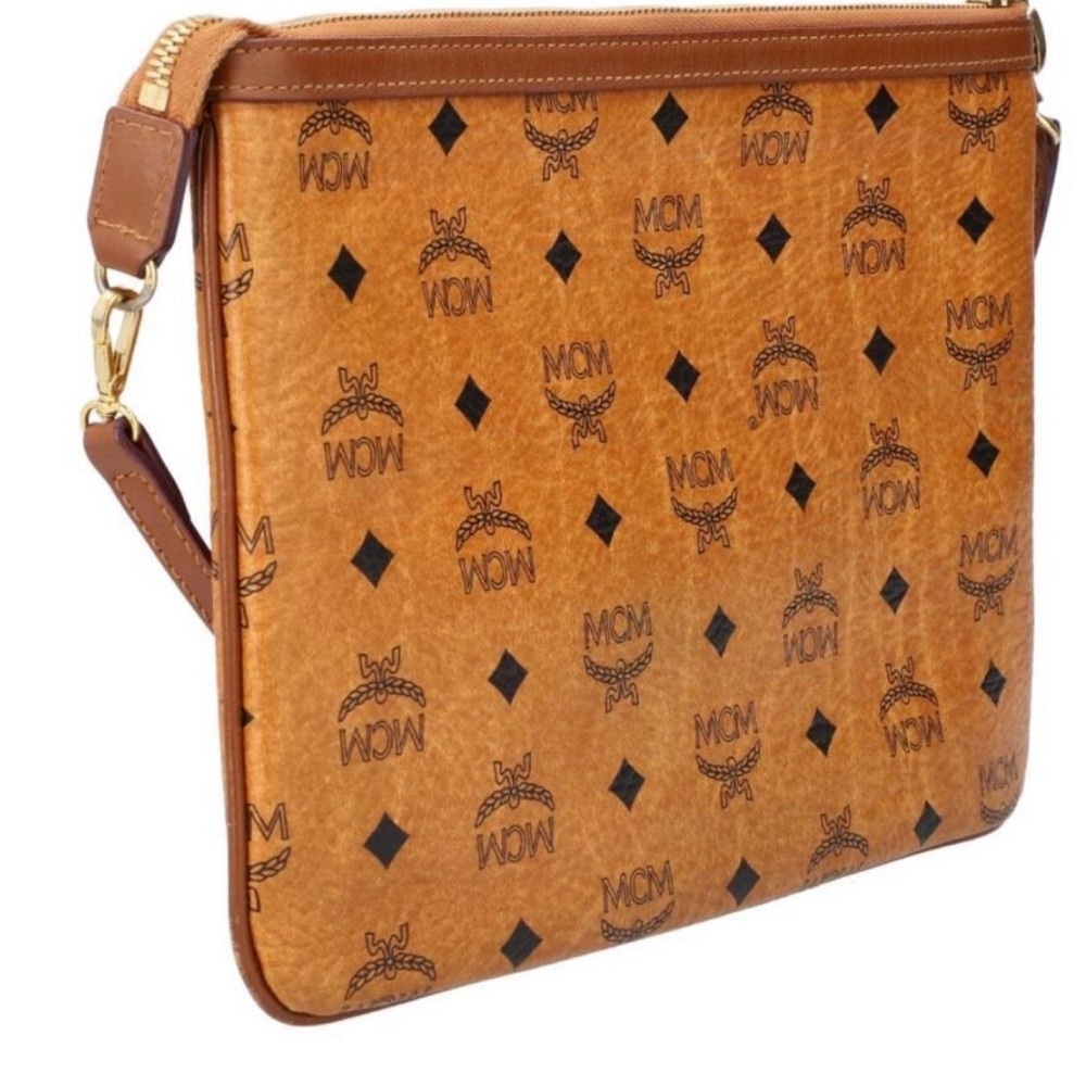 Authentic MCM clutch handbag with removable strap